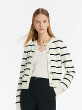 a lady in black and white knitted striped cardigan